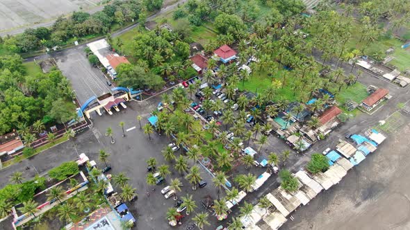 Parking of restaurant at Suwuk village in Kebumen district, Indonesia. Aerial approach