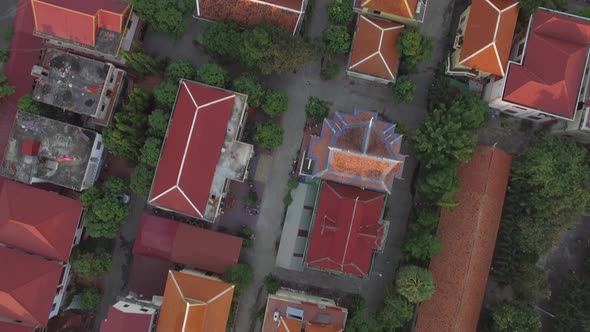 Aerial view above of religious temples during the sunset, Phnom Penh, Cambodia.