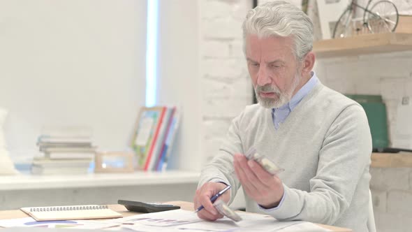 Old Man Controlling Finance, Separating Dollars