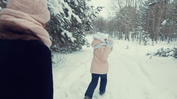 Little Daughter Running From Her Mom