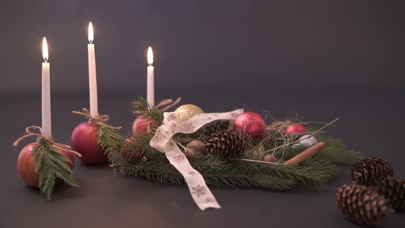 Christmas arrangement and three candles