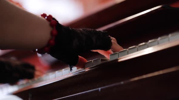 Woman Playing on Vintage Wooden Piano