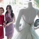 Mother and daughter looking at wedding dress in shop window - VideoHive Item for Sale