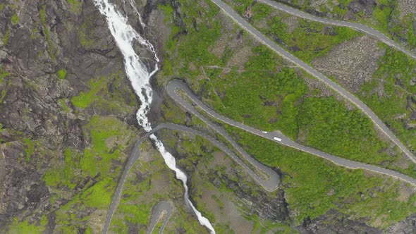 Aerial View Of Vehicles Driving On Serpentine Mountain Road Trollstigen In Rauma, Norway Passing By