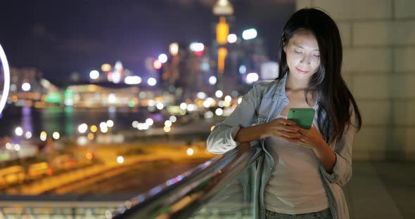 Woman use of cellphone at street