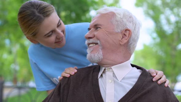 Smiling Social Worker Taking Care of Aged Pensioner Nursing Home Volunteering