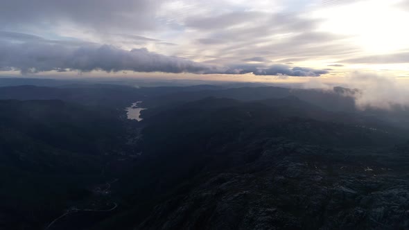 Fly Through the Clouds Over the Mountain Peaks