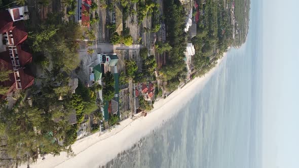 Vertical Video of the Ocean Near the Coast of Zanzibar Tanzania Aerial View