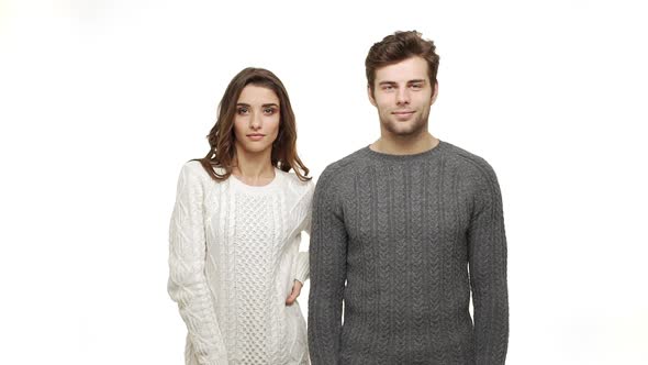 Slow-motion Young Couple in Sweaters Enjoy Dancing Celebrate for Christmas Fun Together Feeling