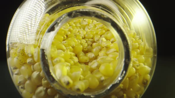 Macro Shot Moving To the Inside of a Jar Filled with Popcorn Seeds