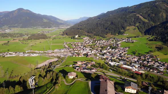 Beautiful Village By The Mountains In Kaprun Austria - aerial shot