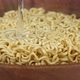 Pouring hot water on noodles in wooden bowl - VideoHive Item for Sale