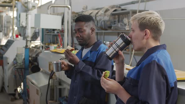  Plant Workers Eating Lunch in Workplace