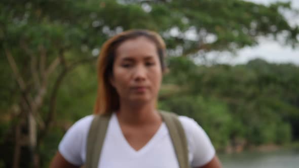 Portrait of woman traveler smiling in the nature