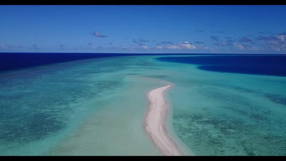 Aerial drone view sky of luxury tourist beach lifestyle by blue green ocean with bright sandy backgr