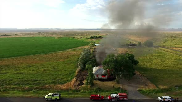 Aerial footage of house burning down