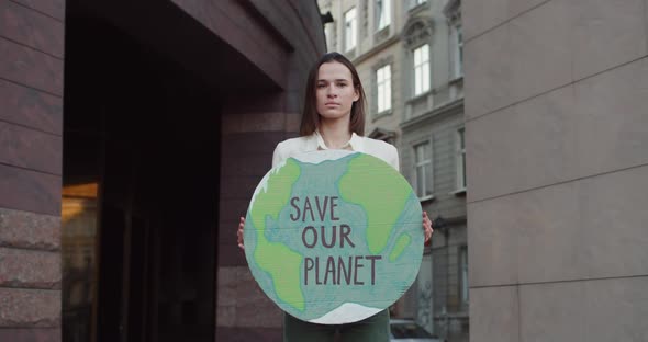 Female Eco Activist Turning Head and Looking To Camera While Standing at street.Young Pretty Woman