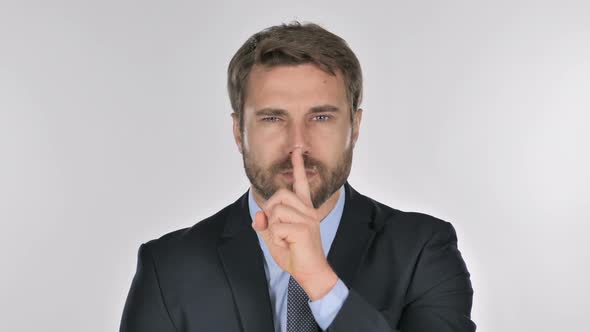 Portrait of Businessman Gesturing  Silence, Finger on Lips