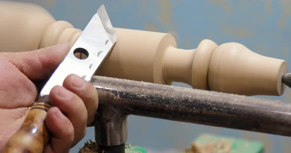 Closeup Carpenter turning wood on a lathe