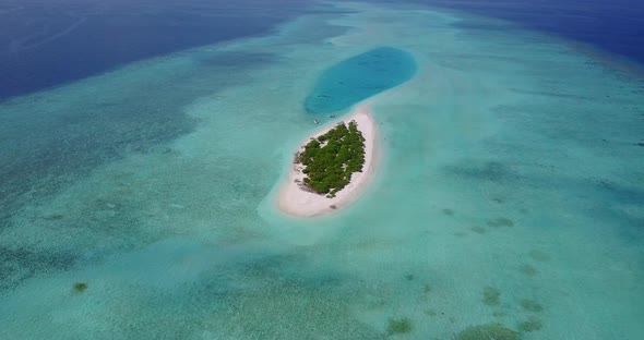 Tropical overhead abstract shot of a white paradise beach and blue sea background in high resolution