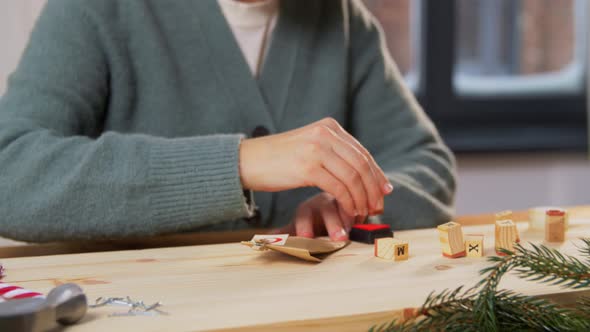 Woman Making Advent Calender on Christmas at Home
