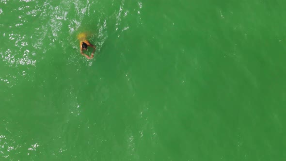 Aerial Top View Woman in Yellow Bikini Swimming in Sea