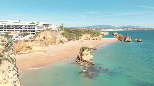 Establishing shot of Dona Ana Beach in Lagos Coastline, Algarve, Portugal