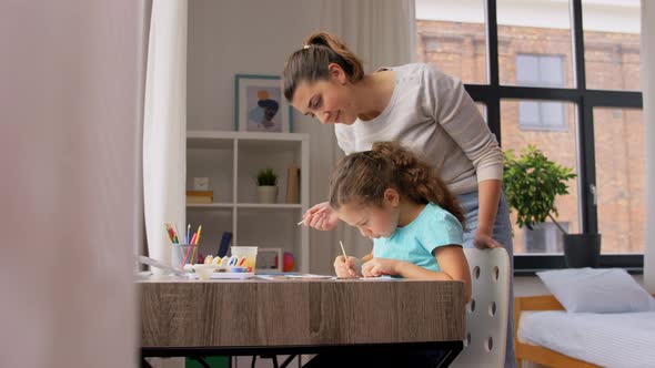 Mother with Little Daughter Drawing at Home