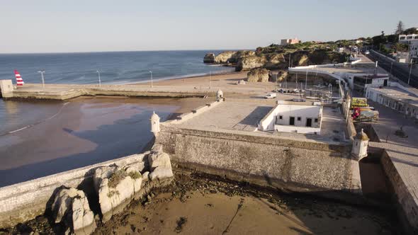 Aerial of the Fort of Ponta da Bandeira and its surrounding coastline in Lagos, Portugal