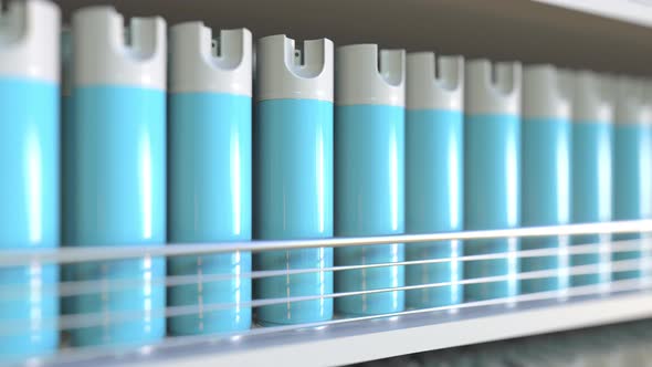 Many Generic Blue Spray Cans on a Store Shelf