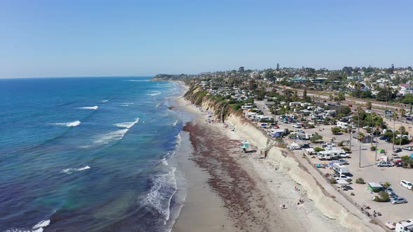 Aerial shot of a beautiful sandy beach and city on the West Coast of America