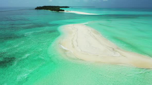 Aerial drone shot landscape of exotic coastline beach time by blue ocean and white sand background o