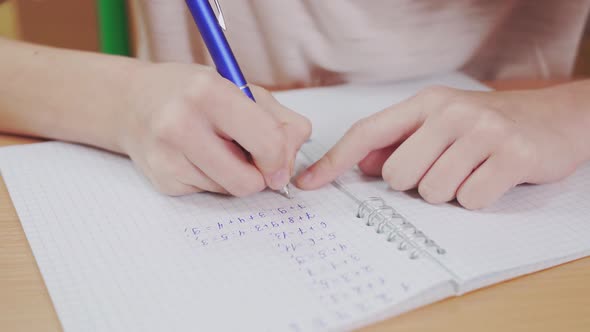 Incognito Schoolgirl Doing Mathematics Homework