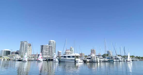 4K Video of Small Sailboats Leaving Marina