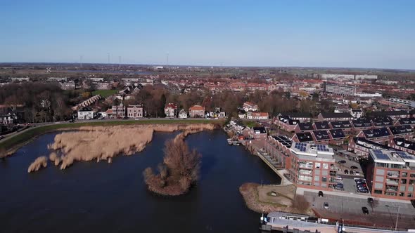 Aerial View Of Alblasserdam Town With Ferry Terminal By Noord River In South Holland, Netherlands.