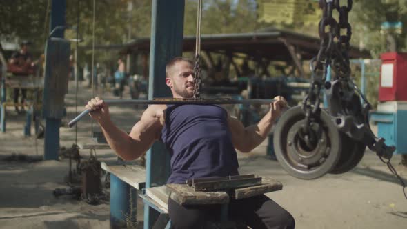 Man Working Out on Cable Lat Pulldown Machine