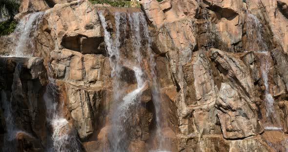 Waterfall over rock wall