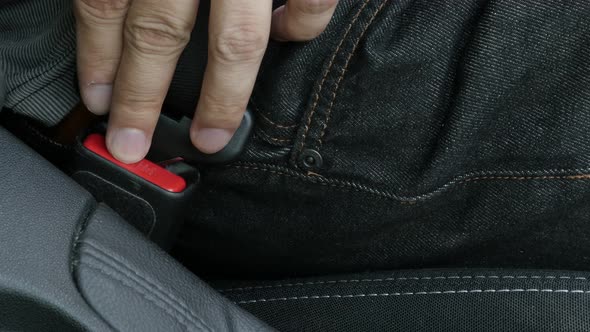 Unlocking three-point seat belt close-up 4k footage