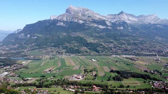 Flying along a large valley in the french Alps. Arve valley.