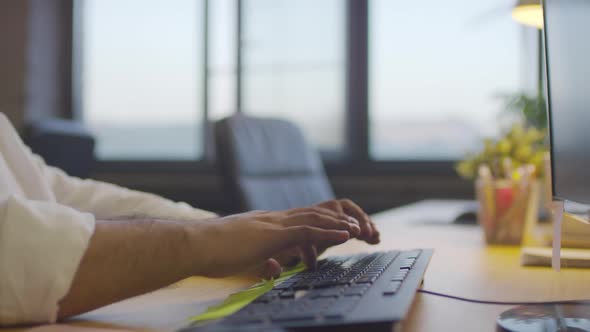 Male Hands Typing on Computer Keyboard