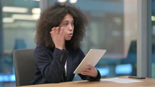 African Businesswoman Talking on Video Call on Tablet