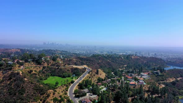 Aerial shot panning left on the LA skyline in Southern California just outside of Los Angeles Ca.