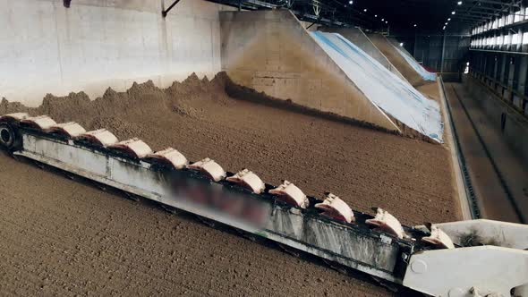 Conveyor Machine Is Leveling and Removing Clay Materials