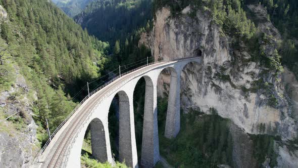 Landwasser Viaduct in Swiss Alps in Summer Aerial View on Green Mountain Valley