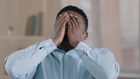 Portrait of Upset Frustrated African American Man Put Hands on Forehead Tired Overwhelmed Young