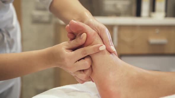 Foot Massage for Client in Spa Resort Center