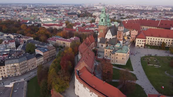 People Visit Famous Wawel Cathedral And Royal Castle With City View Of Krakow In Poland. - aerial