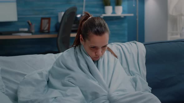 Sick Woman Feeling Cold and Having Chills Because of Illness