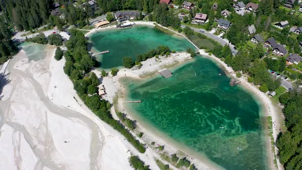 Aerial footage of a beautiful lake with turquoise water, side view of Jasna lake