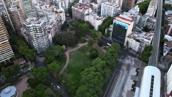 Orbital of Barrancas de Belgrano park near train station surrounded by buildings in busy Buenos Aire